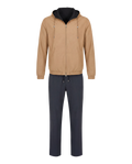 Beige jacket with black hood and navy pants on a white background