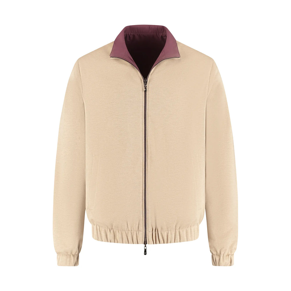 Beige jacket with a purple collar on a white background