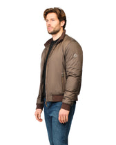 Man wearing a brown jacket on a white background