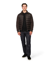 Man wearing a brown puffer jacket