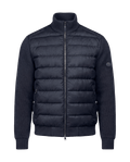 Blue puffer jacket on a black background