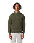 Man wearing a green quarter-zip sweater on a white background