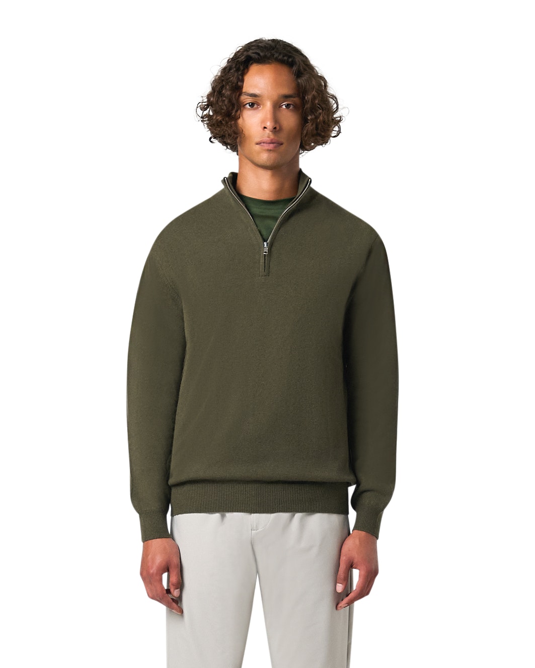 Man wearing a green quarter-zip sweater on a white background