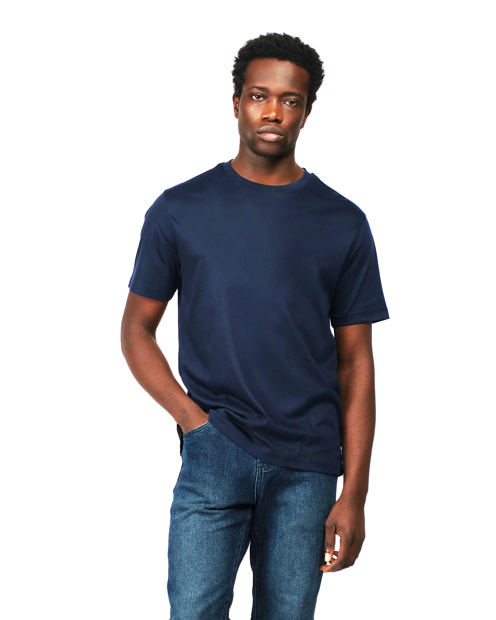 Man wearing a navy blue t-shirt and jeans on a white background