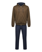 Brown hoodie and blue pants on a black background