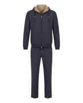 Navy tracksuit with beige hood on a white background