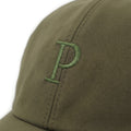 Green cap with a logo on a white background