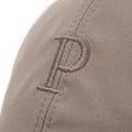 Close-up of a gray cap with an embroidered letter 'P' on a white background