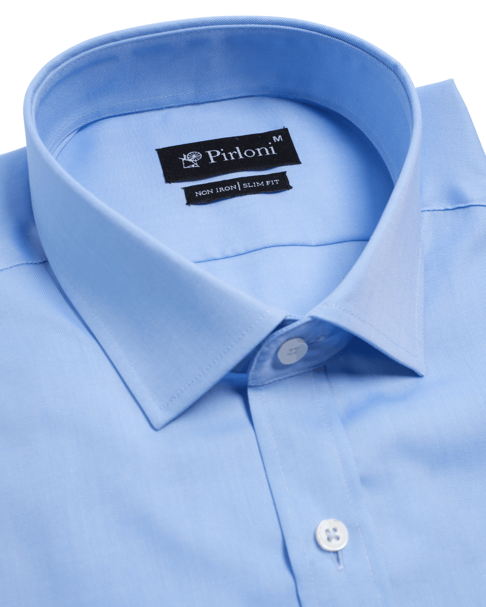 Close-up of a light blue dress shirt with collar and button, featuring the Pirlom brand label.