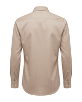 Beige shirt on a black background