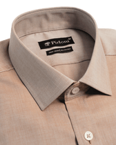 Close-up of a beige shirt collar with Pirloni label on a black background
