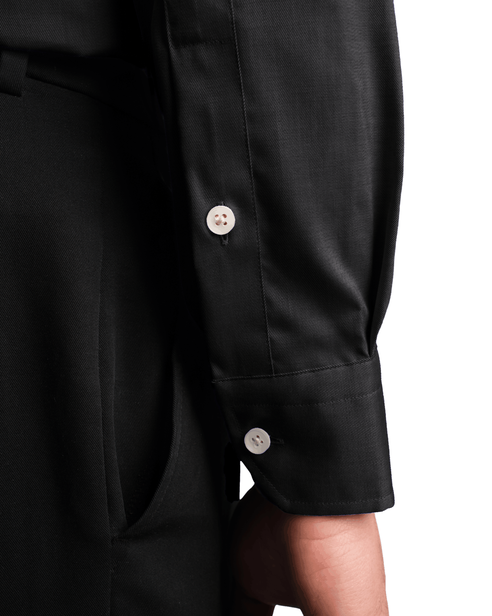 Close-up of a black shirt with buttons on a black background