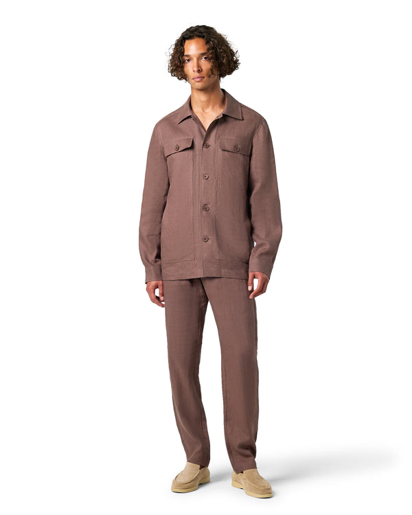 Man wearing a brown jumpsuit on a white background