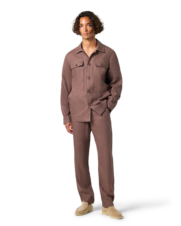 Man wearing a brown outfit on a white background
