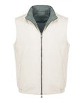 White puffer vest with green inner lining on a white background