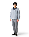 Man wearing a gray jacket and pants 