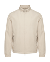 Beige jacket on a black background