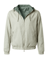 Beige jacket with a green hood 