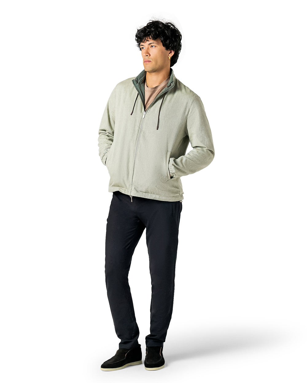 Man wearing a light gray jacket and dark pants