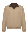 Beige jacket with brown collar on a black background