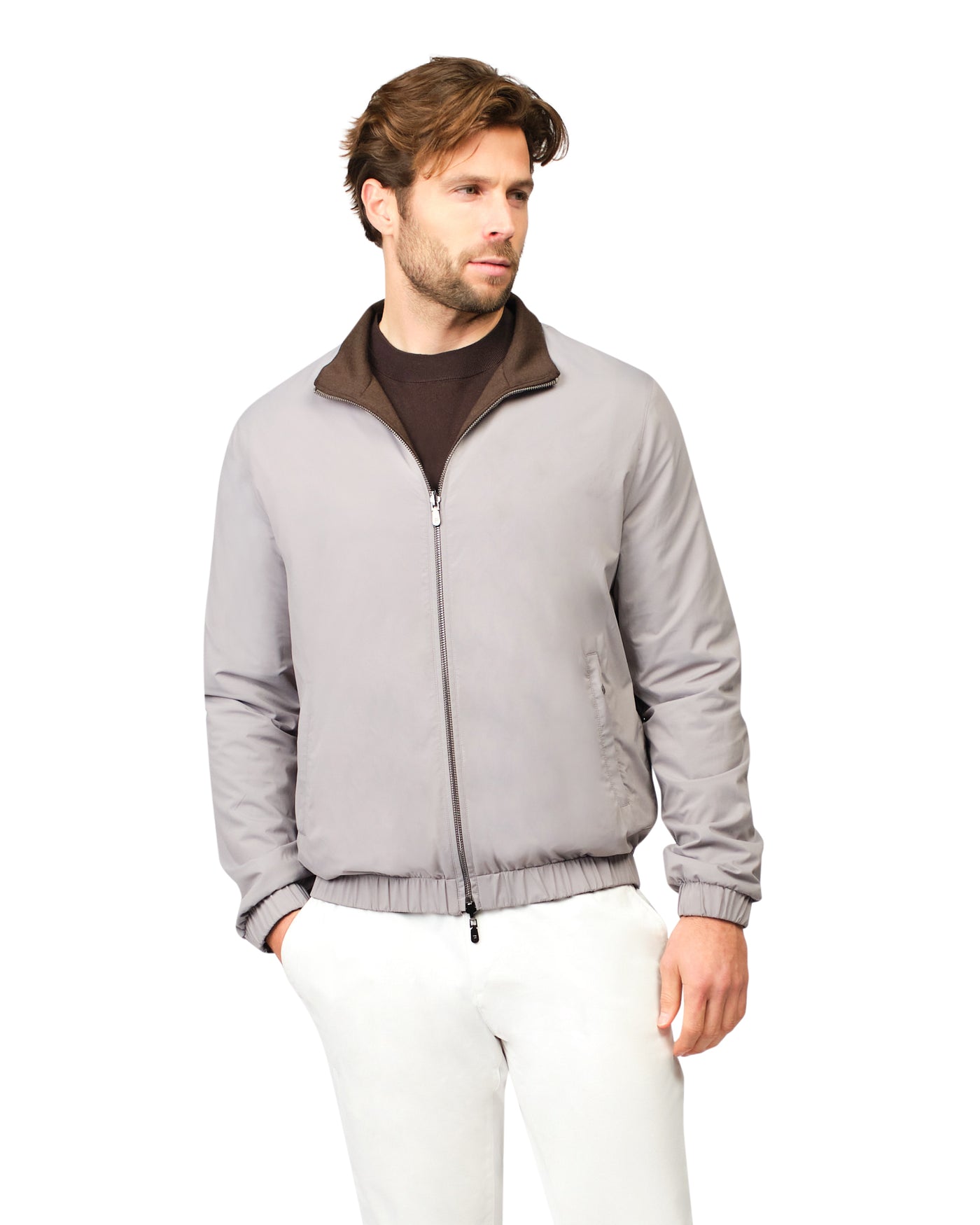 Man wearing a gray jacket with a brown collar 