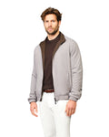 Man wearing a gray jacket with a brown collar