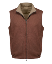 Brown vest with beige collar on a white background