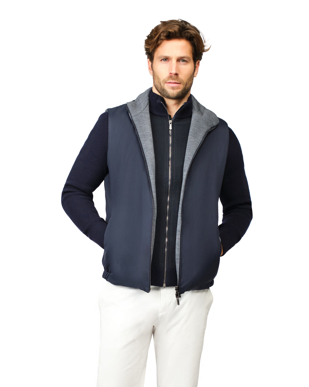 Man wearing a navy blue vest with gray hood on a white background