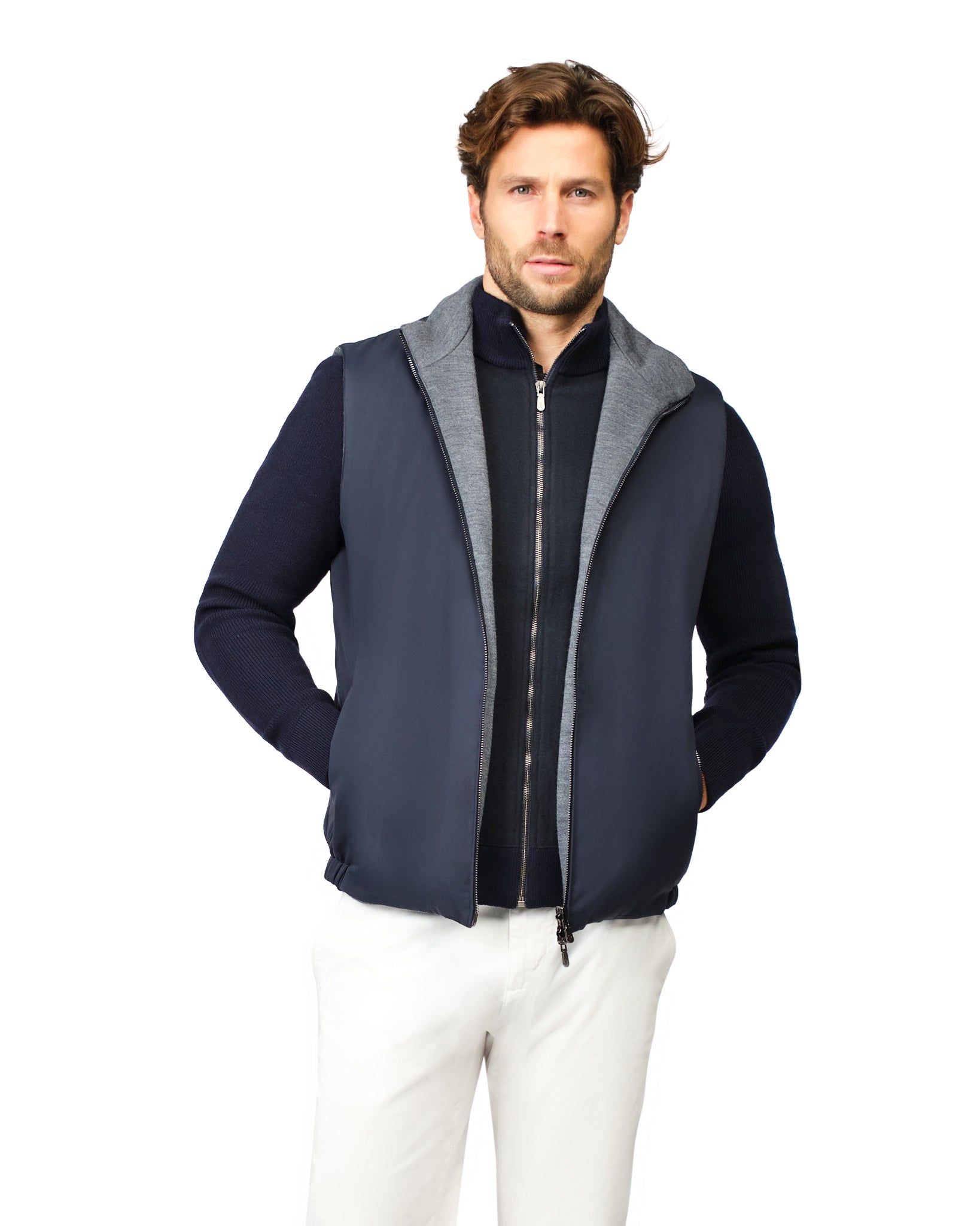 Man wearing a navy blue vest with gray hood on a white background