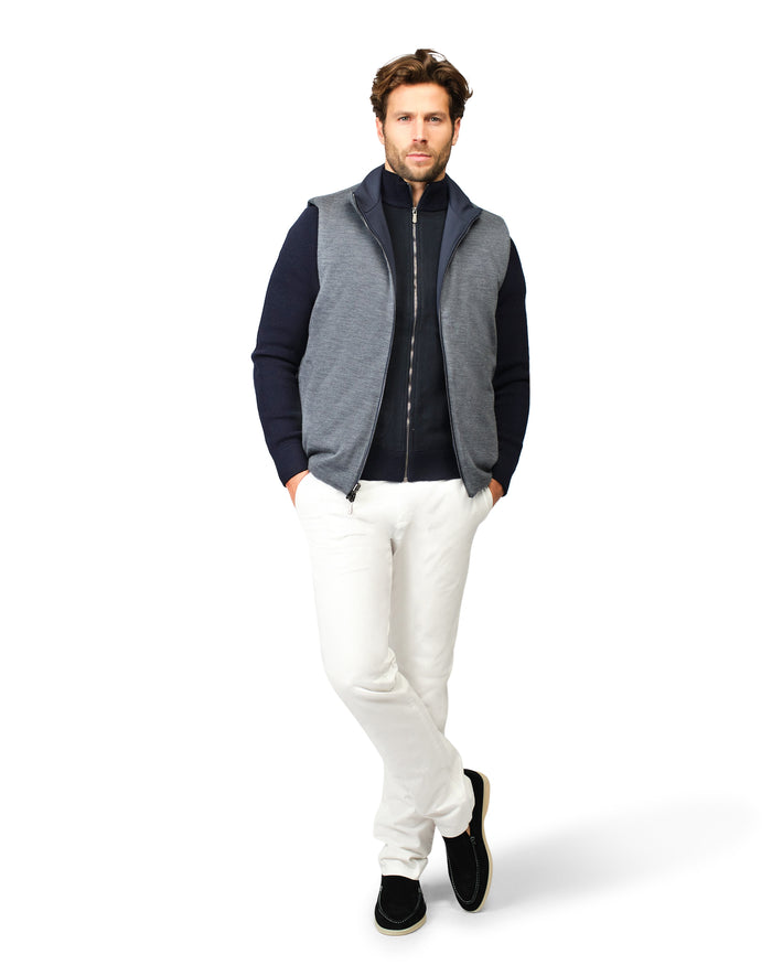 Man wearing a two-tone jacket with a white background
