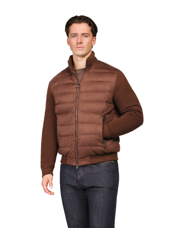 Man wearing a brown puffer jacket on a white background