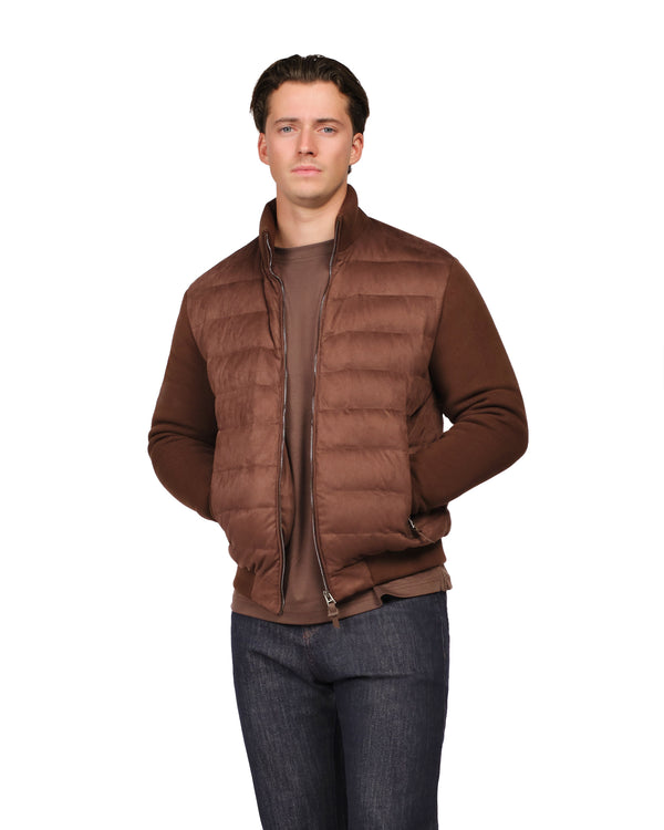 Man wearing a brown puffer jacket on a white background
