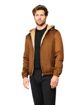 Man wearing a brown jacket with a white background