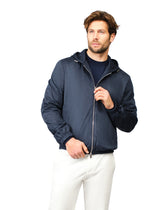 Man wearing a navy blue jacket on a white background