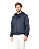 Man wearing a navy blue jacket on a white background