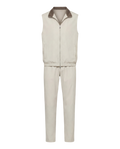 Beige sleeveless jacket and pants set on a white background