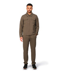 Man wearing a brown jumpsuit on a white background