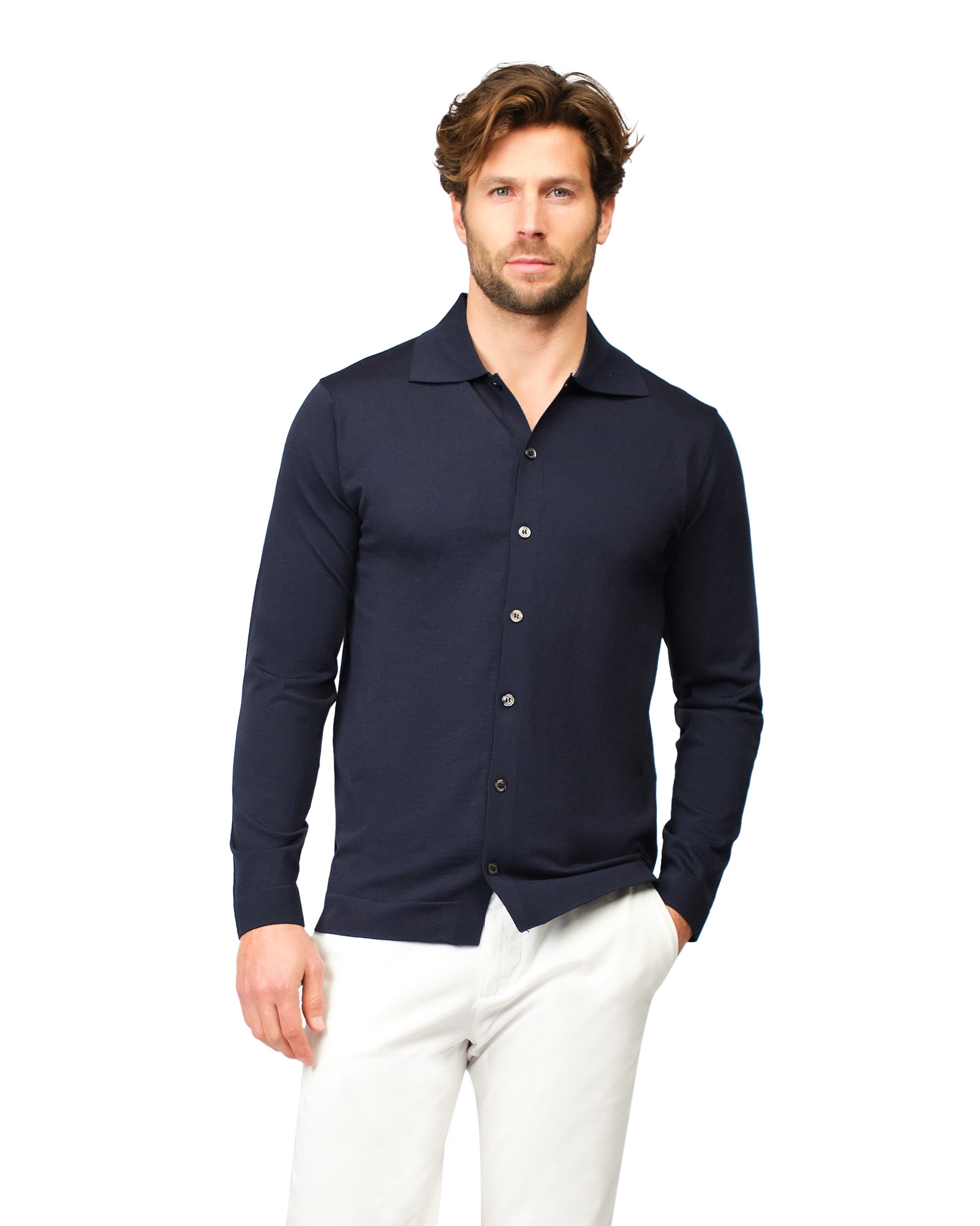 Man wearing a navy long-sleeve shirt with a collar on a white background