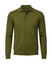 Green button-up shirt on a black background
