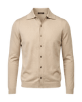 Beige cardigan with button details on a black background