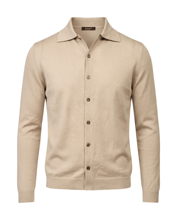 Beige cardigan with button details on a black background