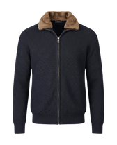 Navy blue zip-up sweater with brown fur collar on a black background