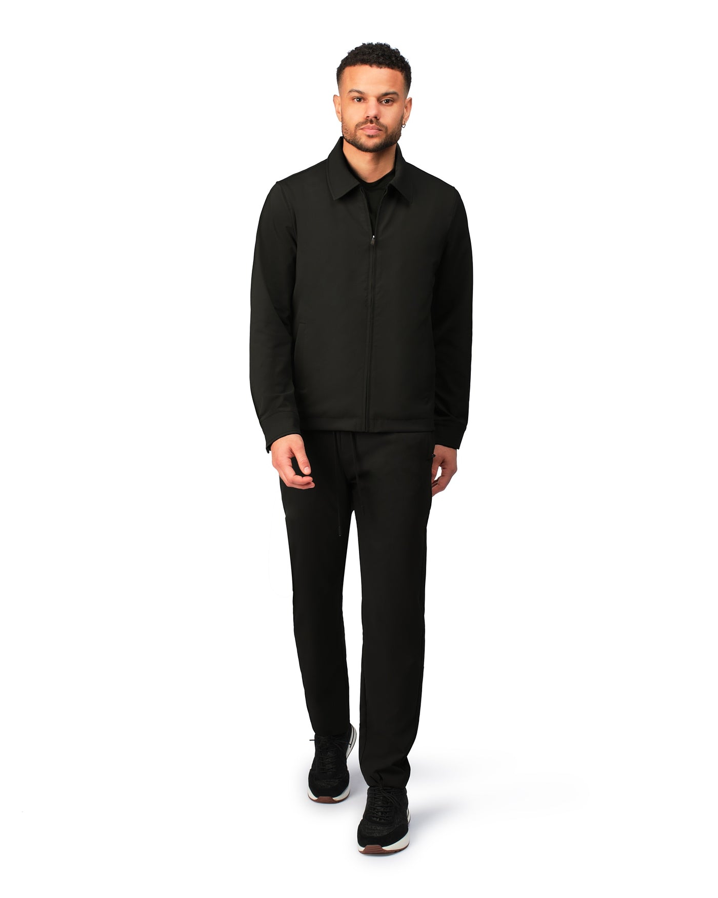 Black tech jacket with modern design and front zipper, detailed product view