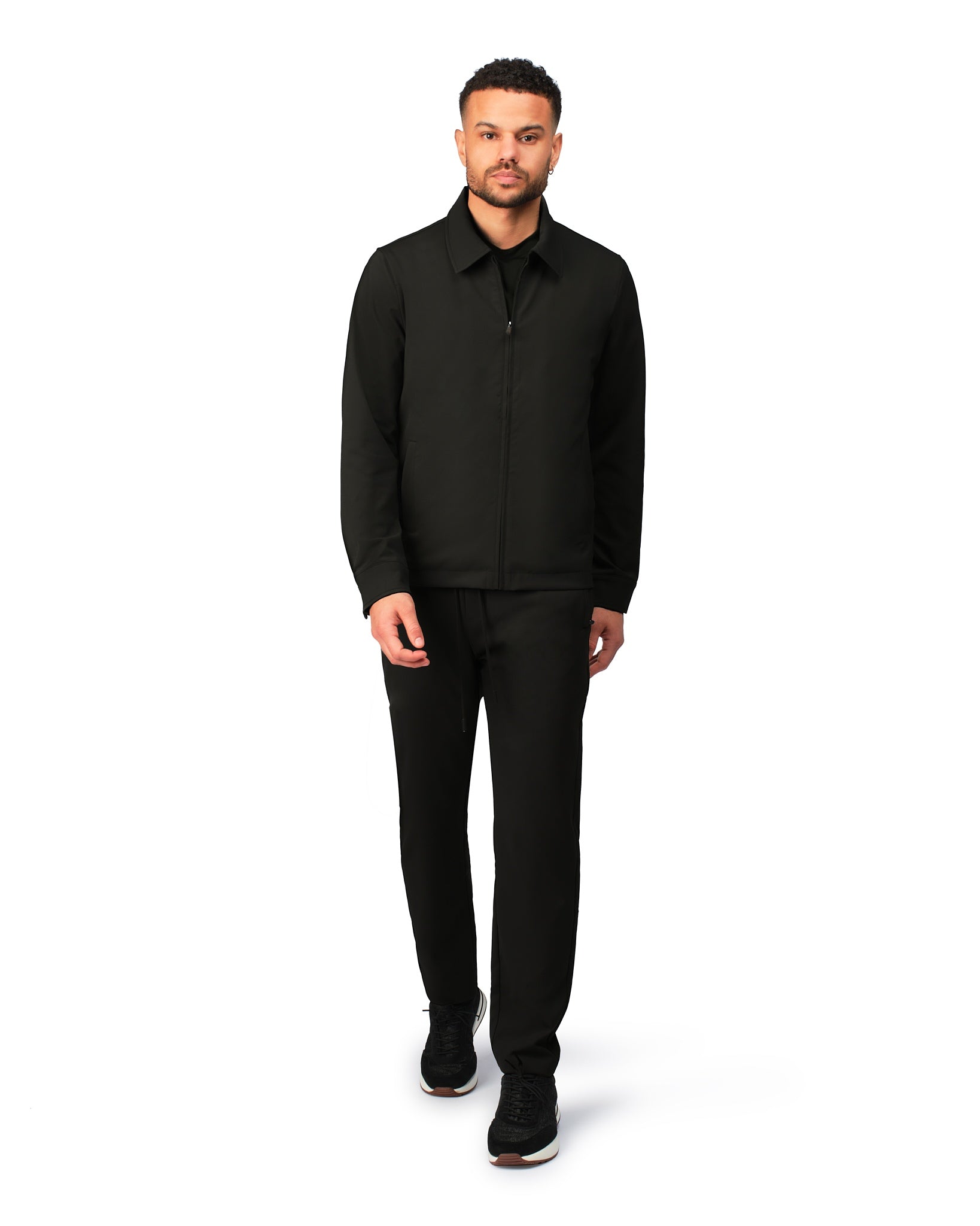 Black tech jacket with modern design and front zipper, detailed product view