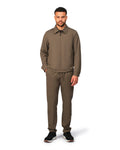 Man wearing a brown outfit on a white background