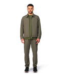 Green tech jacket with sleek design and zip closure, angled product view showing fit and details.
