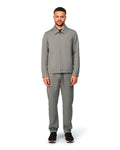 Grey tech jacket with sleek design and zip closure, angled product view showing fit and details.
