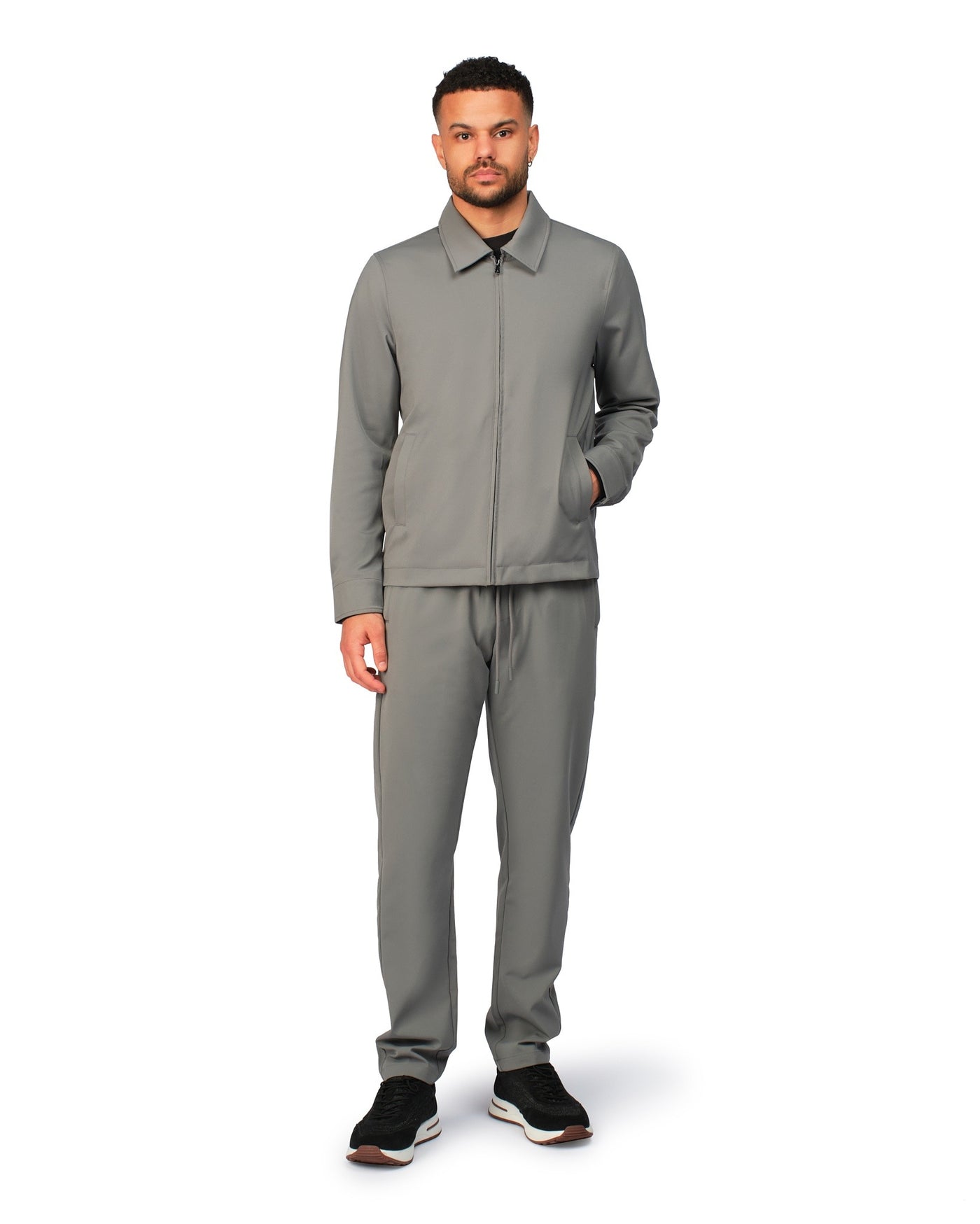 Grey tech jacket with modern design and front zipper, detailed product view.