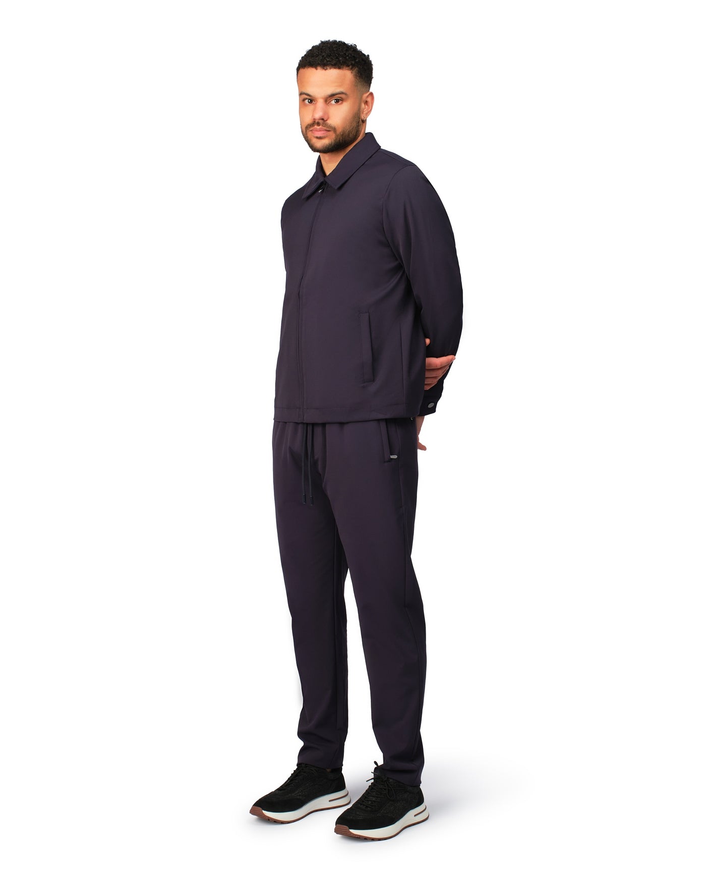 Navy tech jacket with modern design and front zipper, detailed product view.