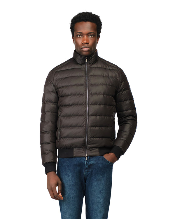 Man wearing a brown puffer jacket on a white background